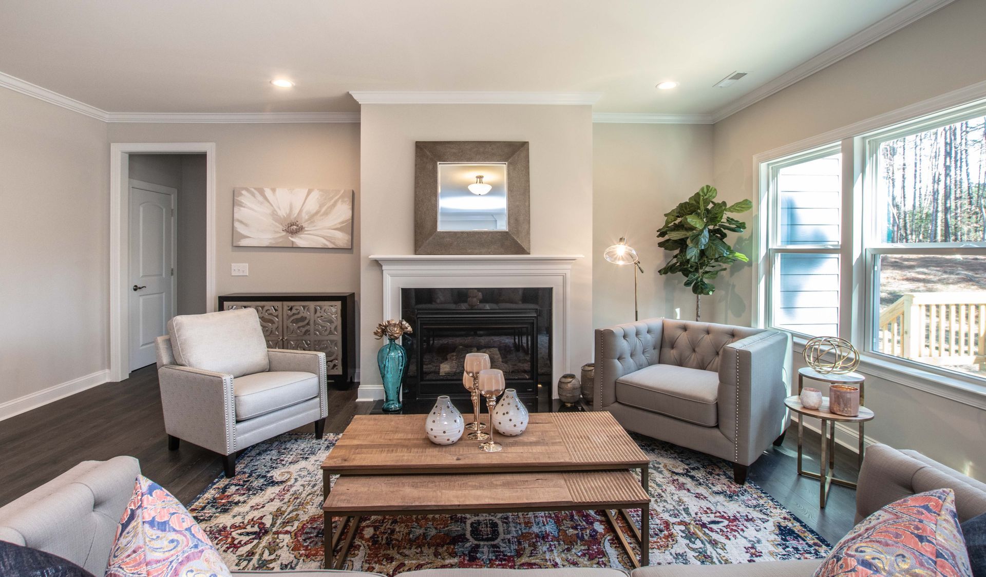 A living room filled with furniture and a fireplace.