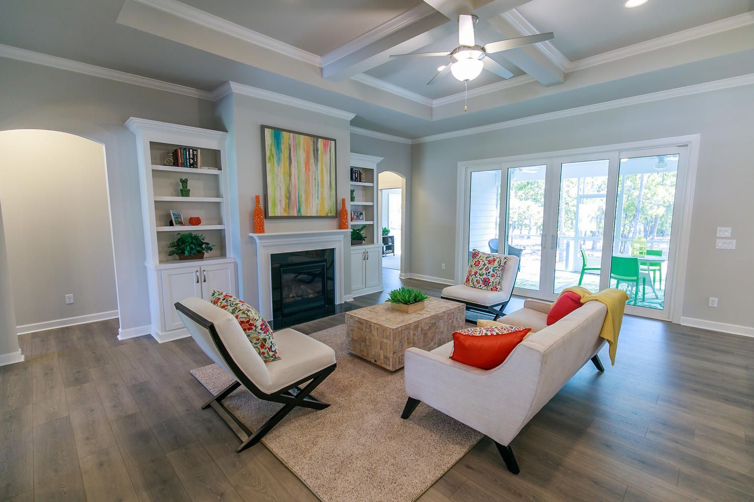 A living room filled with furniture and a fireplace.