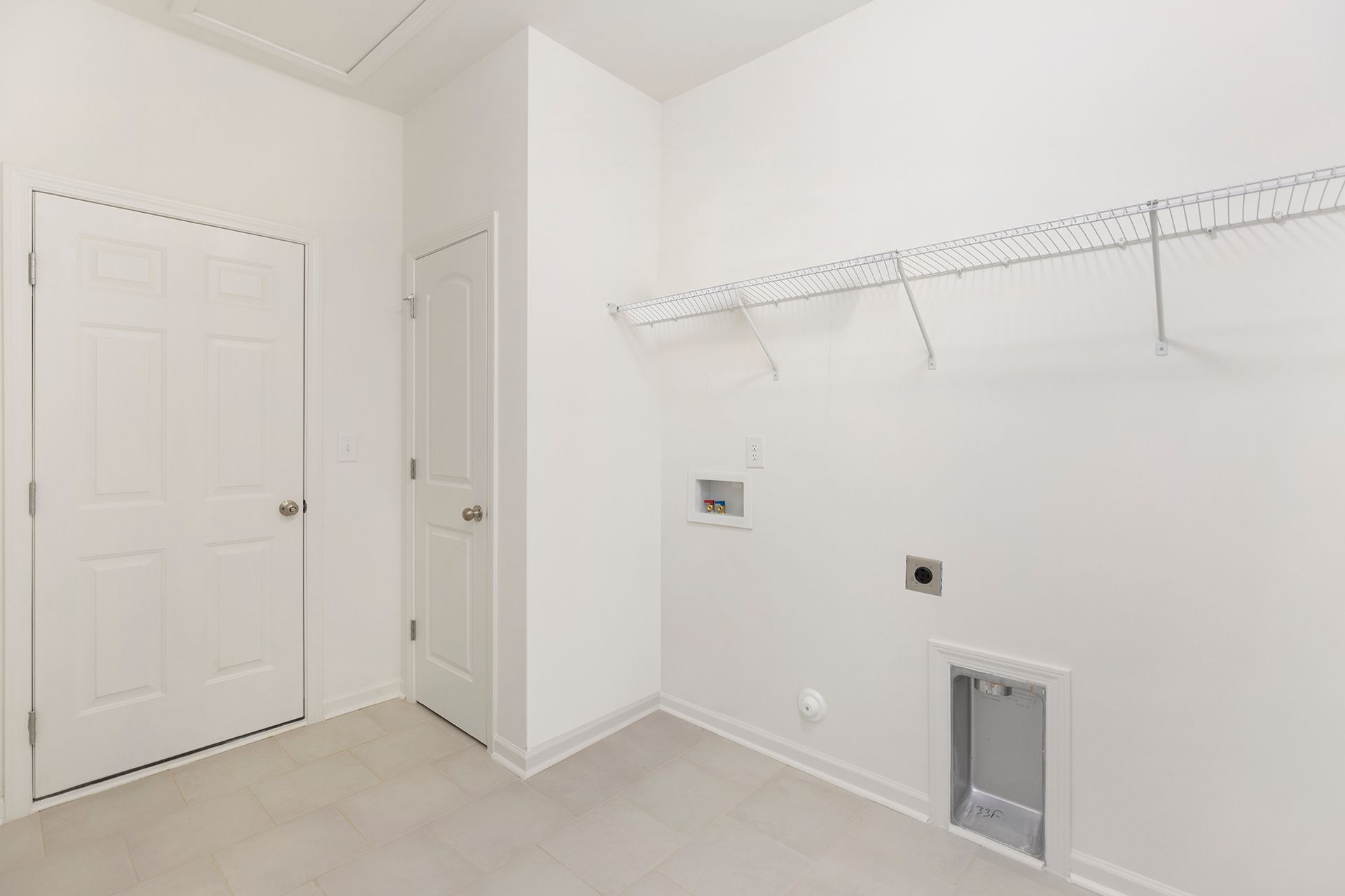 There is a dog door in the laundry room.