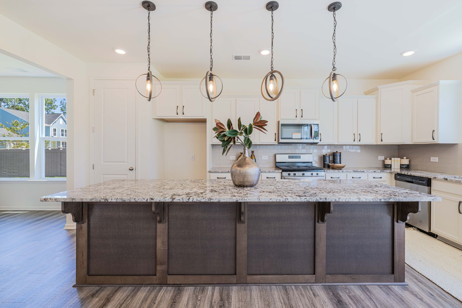 There is a large island in the middle of the kitchen.