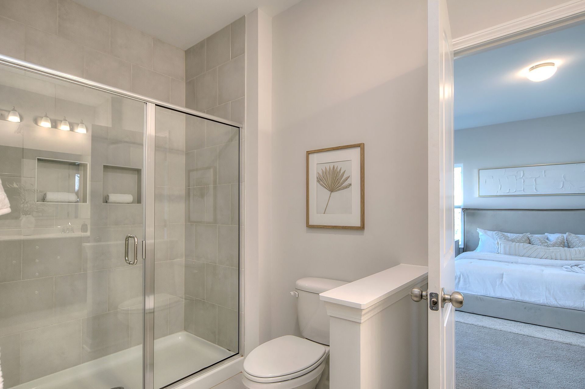 A bathroom with a toilet , bathtub and shower.