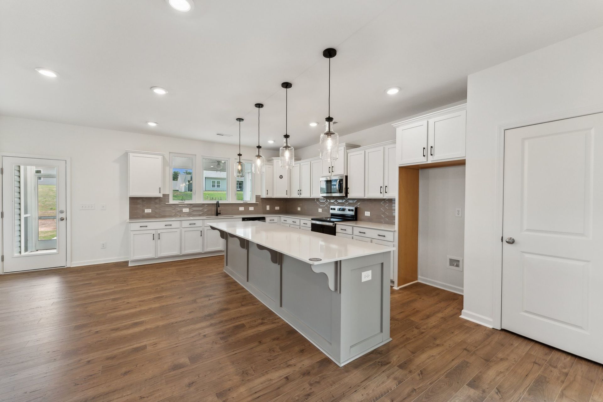 There is a large island in the middle of the kitchen.