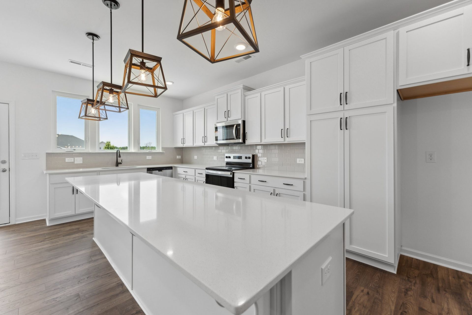There is a large island in the middle of the kitchen.