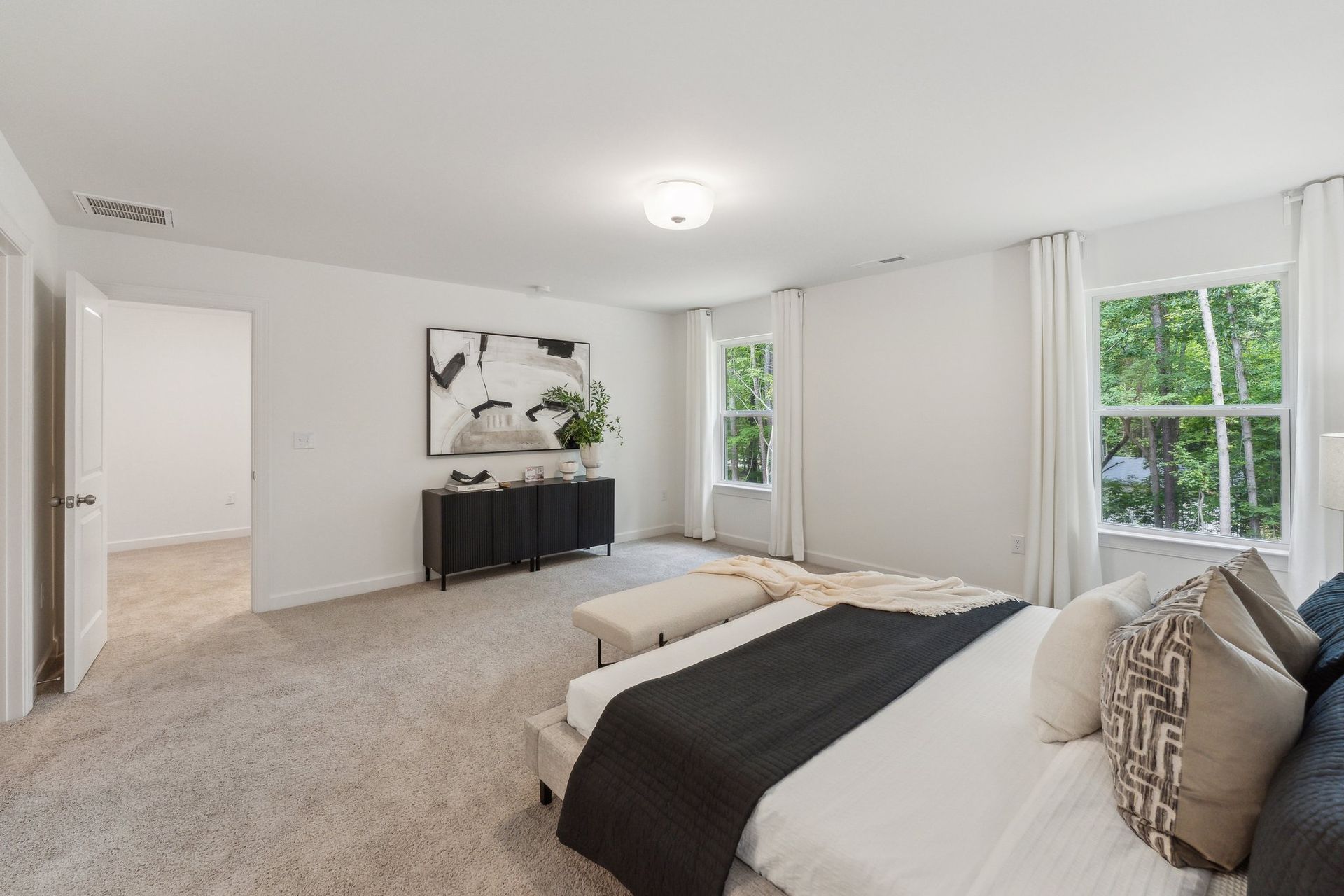 There is a large bed in the middle of the room.