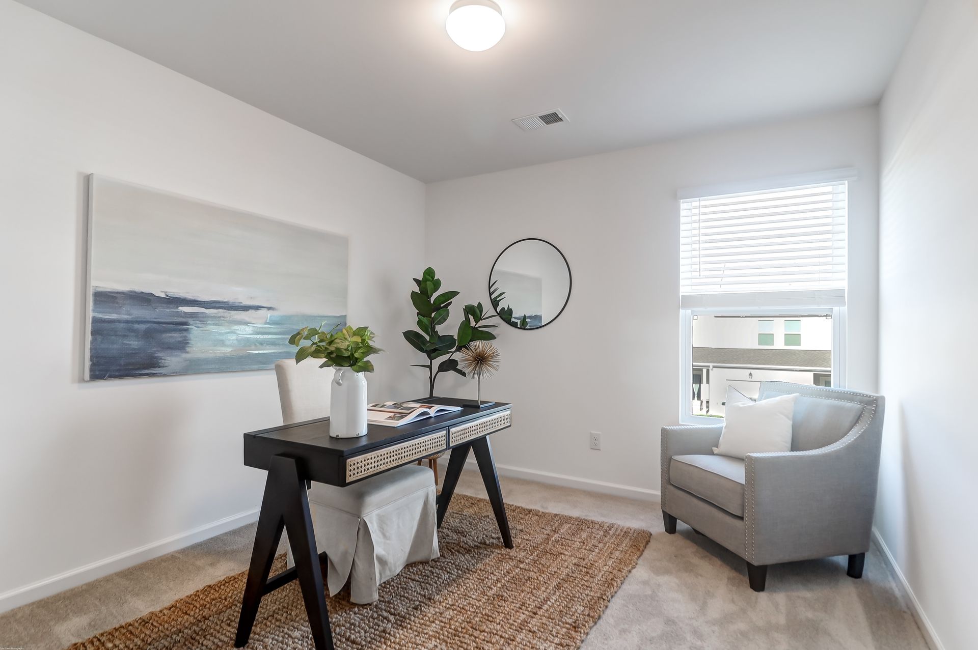 There is a desk and chair in the room.