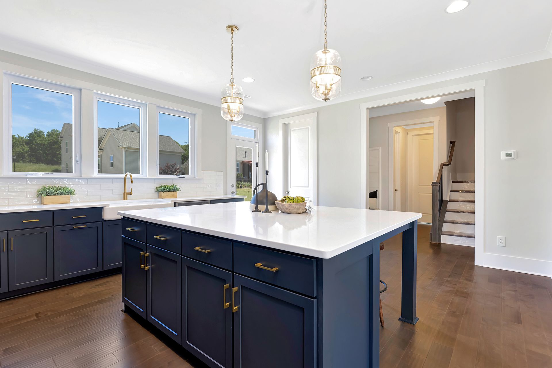 There is a large island in the middle of the kitchen.