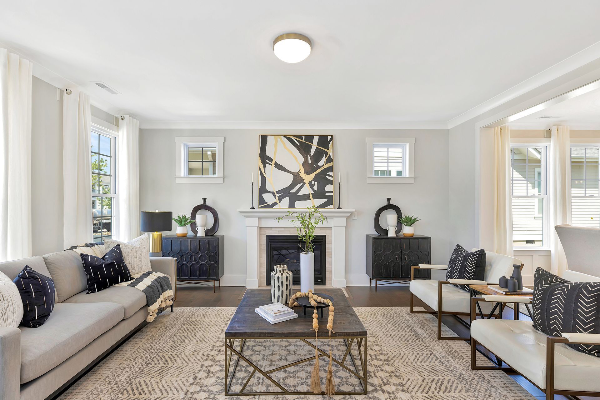 A living room filled with furniture and a fireplace.