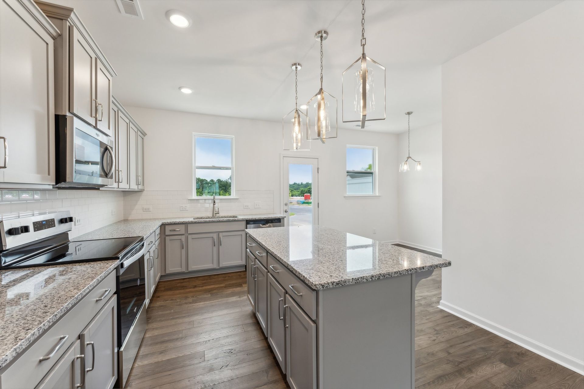 A kitchen with a large island in the middle of the room.