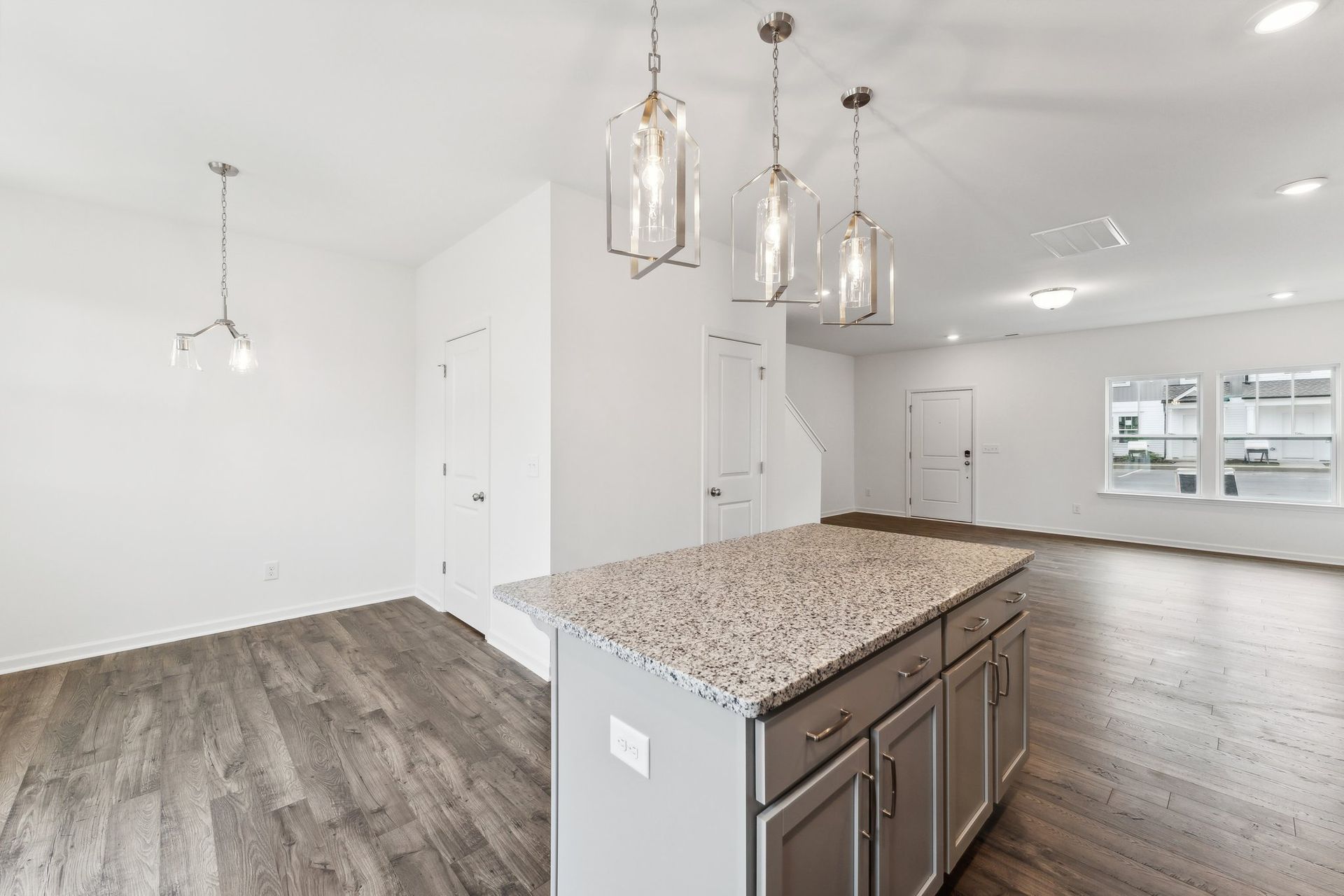 There is a large island in the middle of the kitchen.
