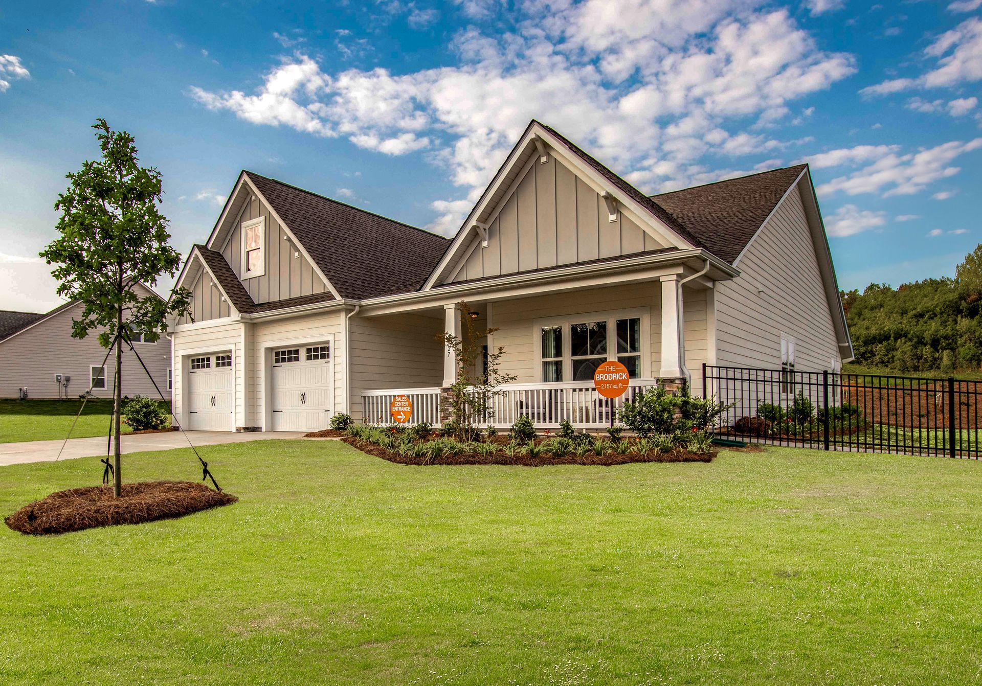 a large white house with a large lawn in front of it .
