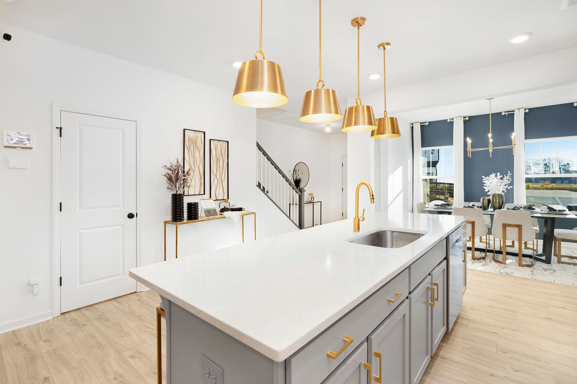 A kitchen with a large island and a sink.