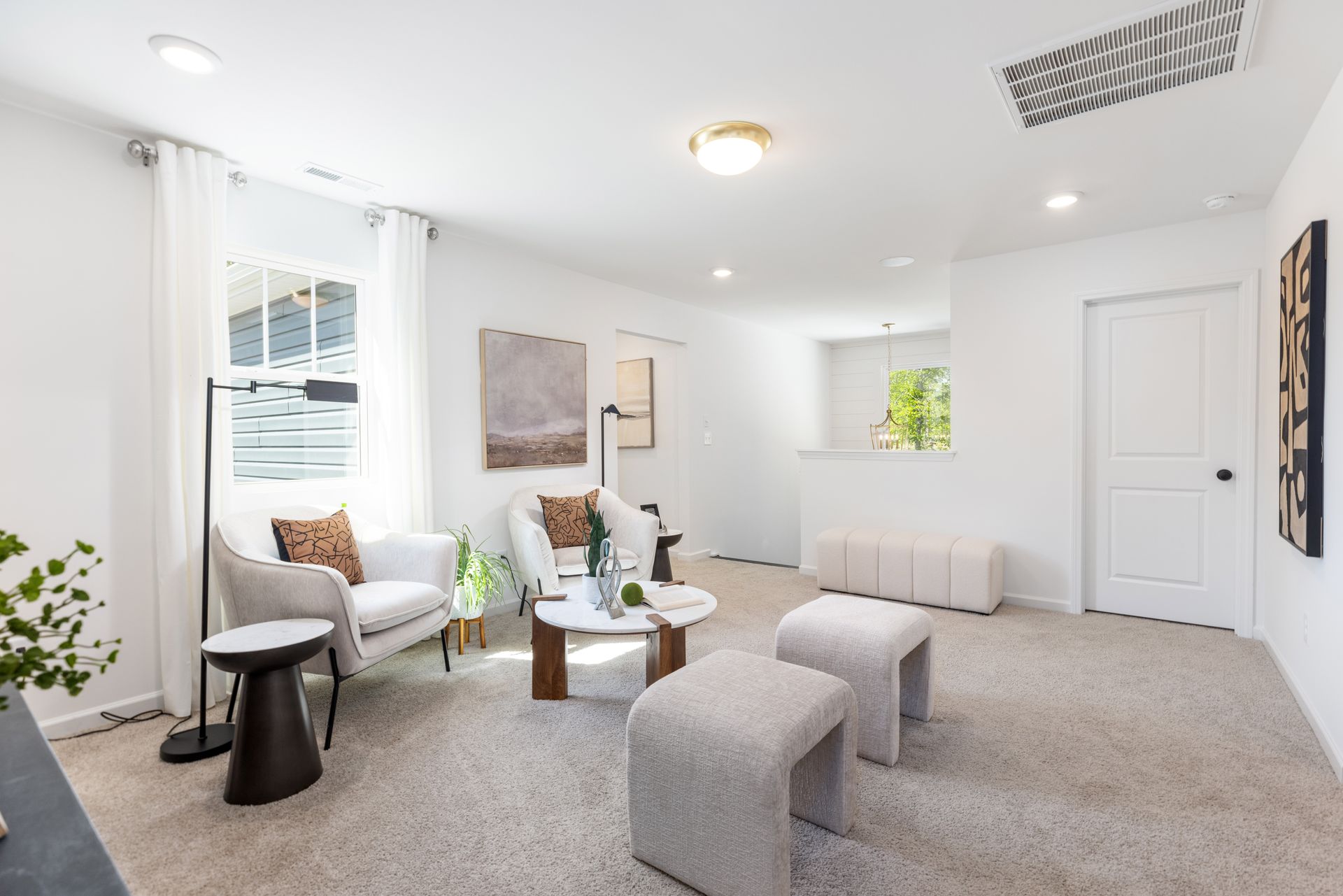 A living room with a lot of furniture and a table