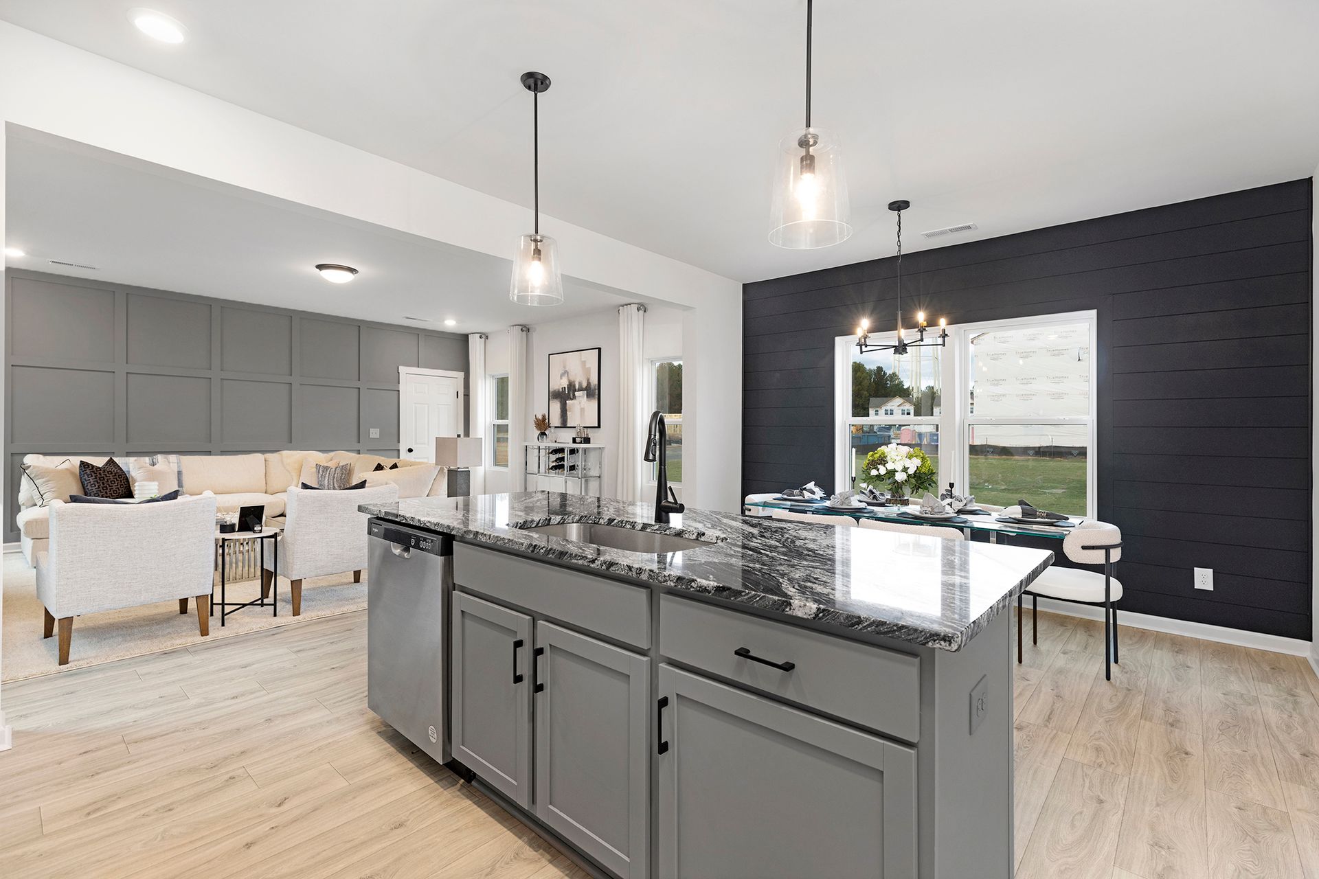 A kitchen with a large island in the middle of the room.