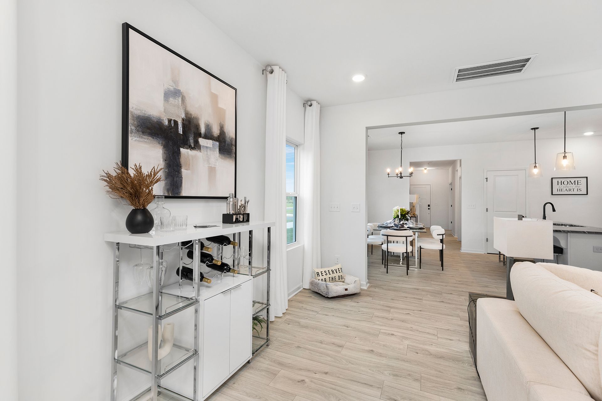 A living room with a couch and a painting on the wall