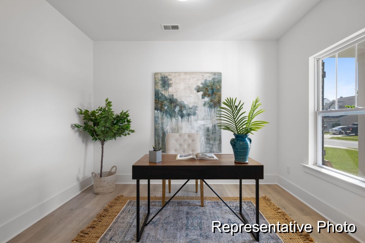 A representative photo of a home office with a desk and chair.