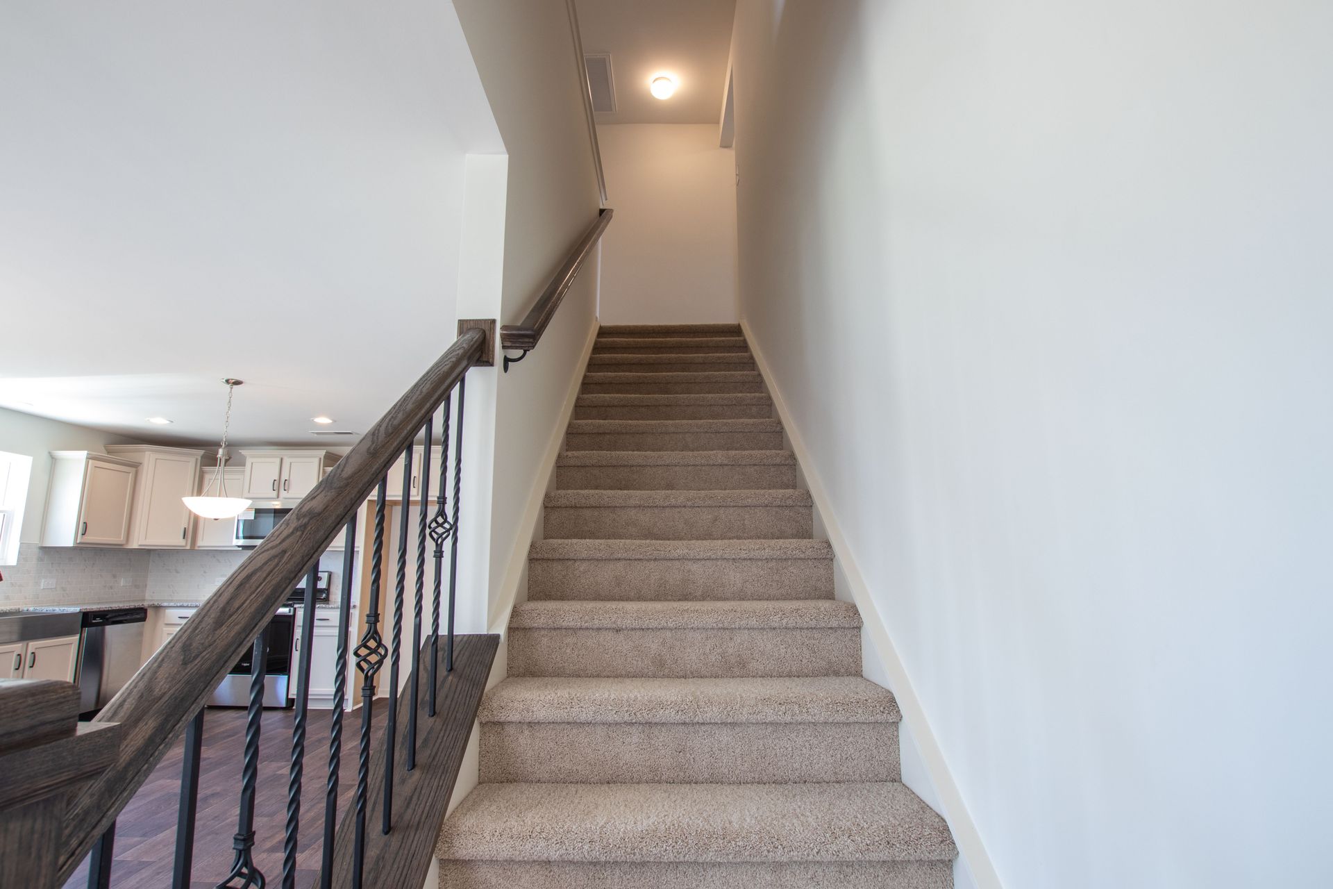 A set of stairs leading up to the second floor of a house.