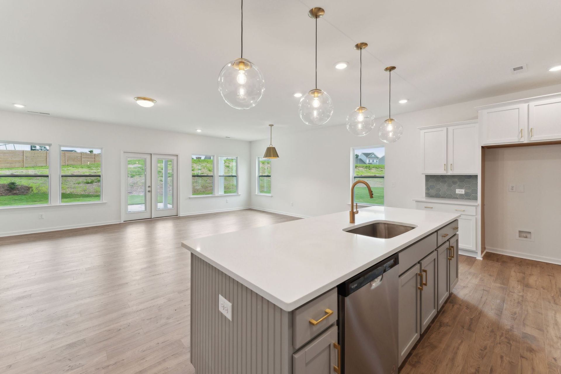 There is a large island in the middle of the kitchen.