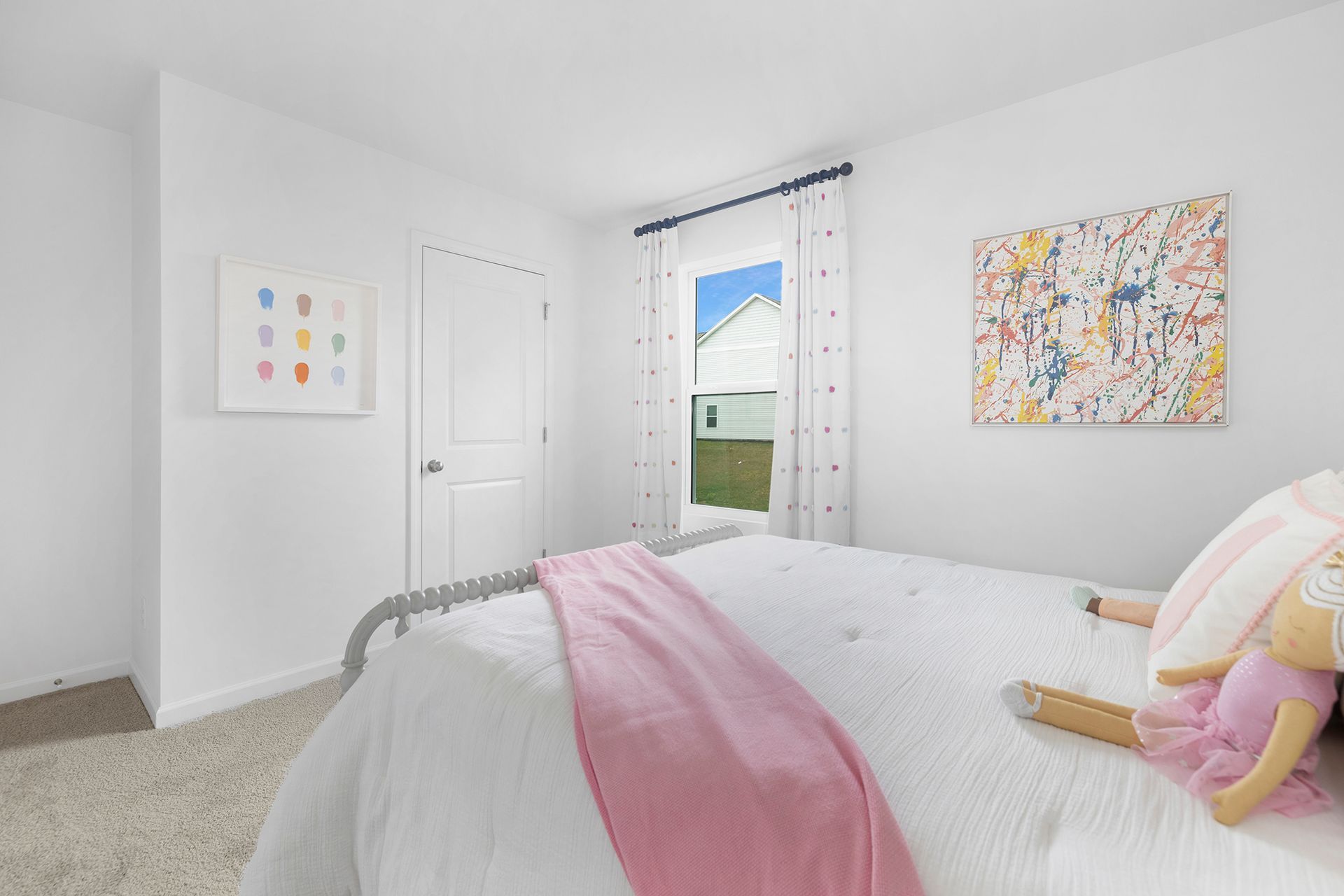A bedroom with a bed , a window , and a painting on the wall.