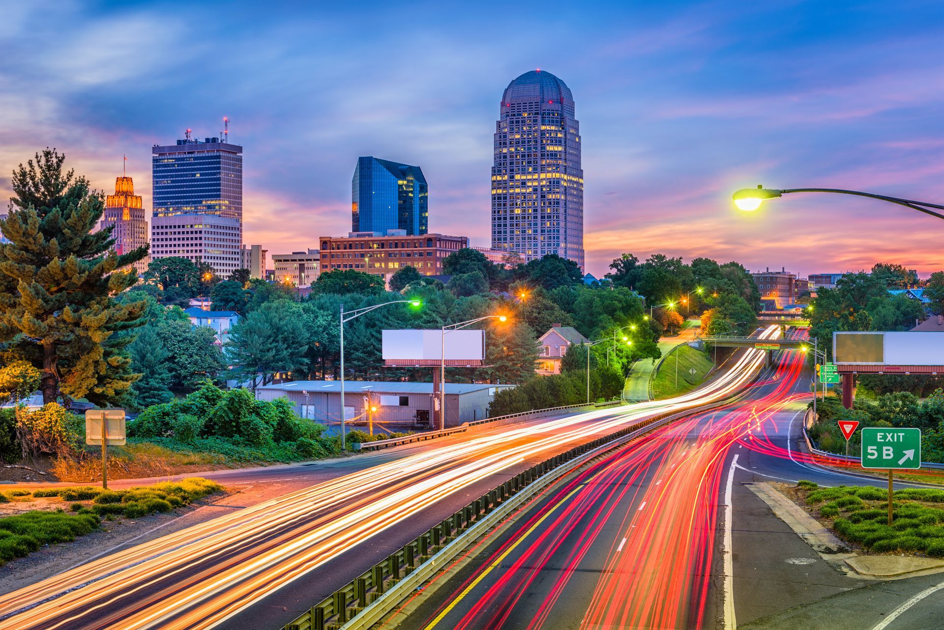 a highway in Winston-Salem with a sign that says exit 56