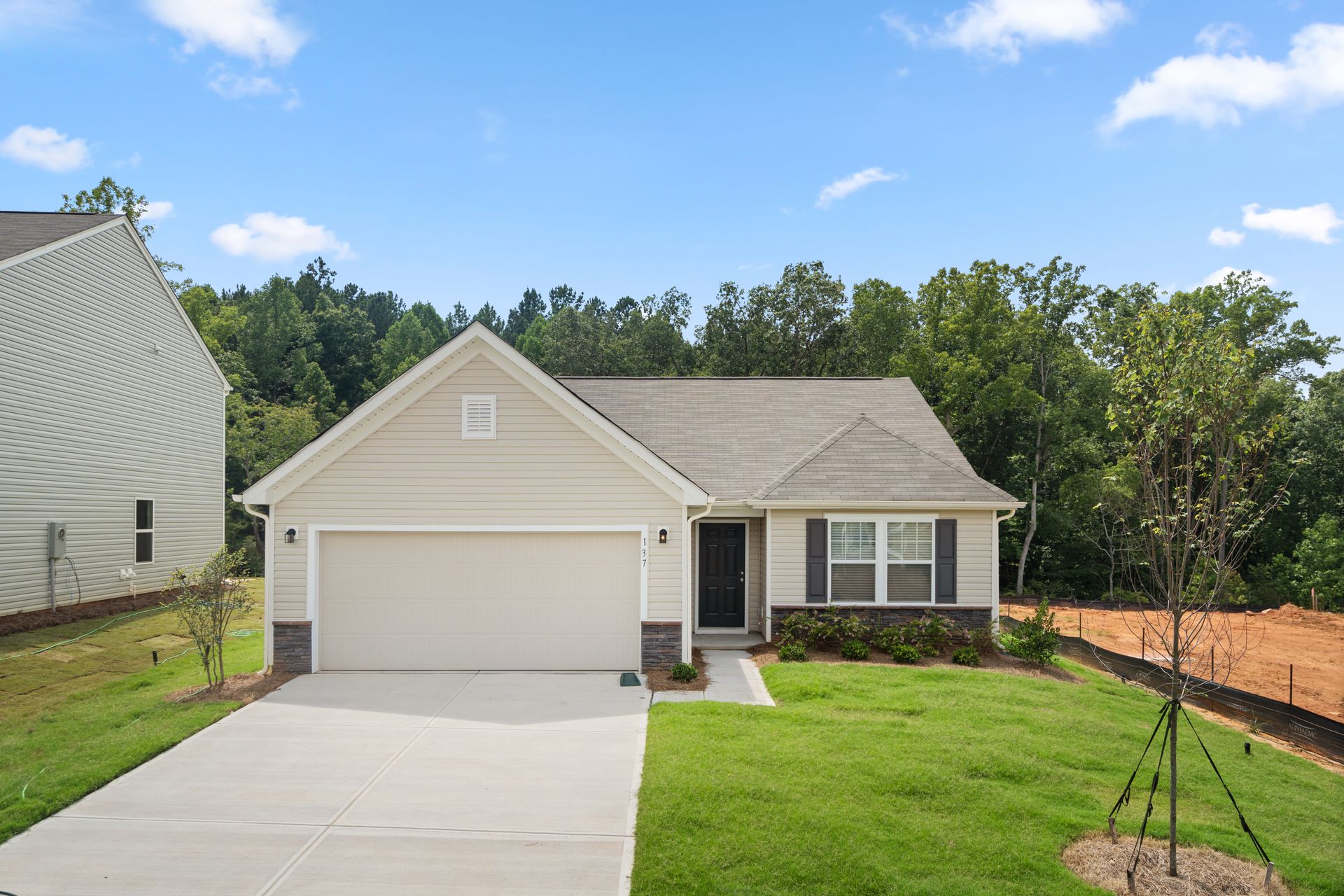 The front of a house with a garage and a driveway