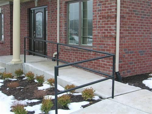 Brick building entrance with a concrete ramp