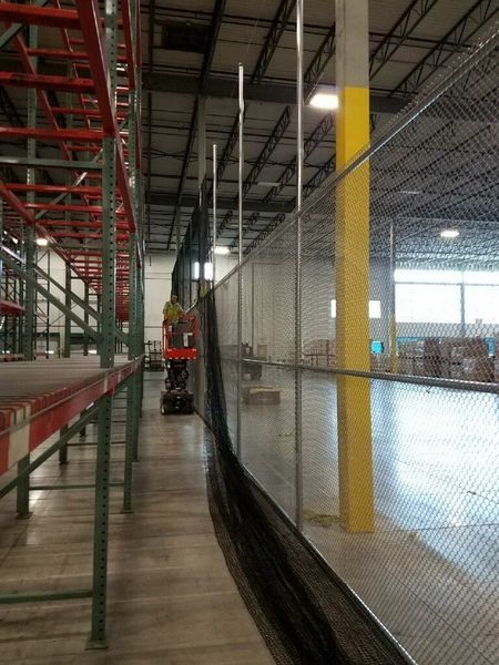 Warehouse with netting barrier