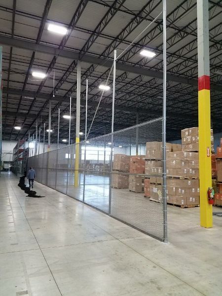 Warehouse interior with chain link fence