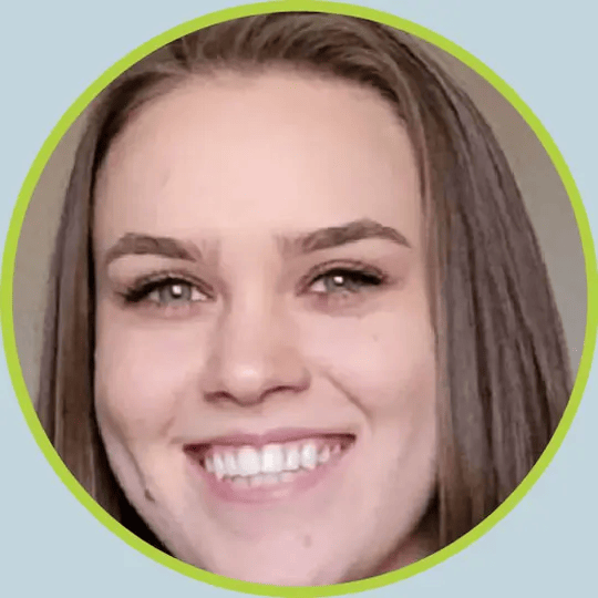 A close up of a woman 's face smiling in a circle.