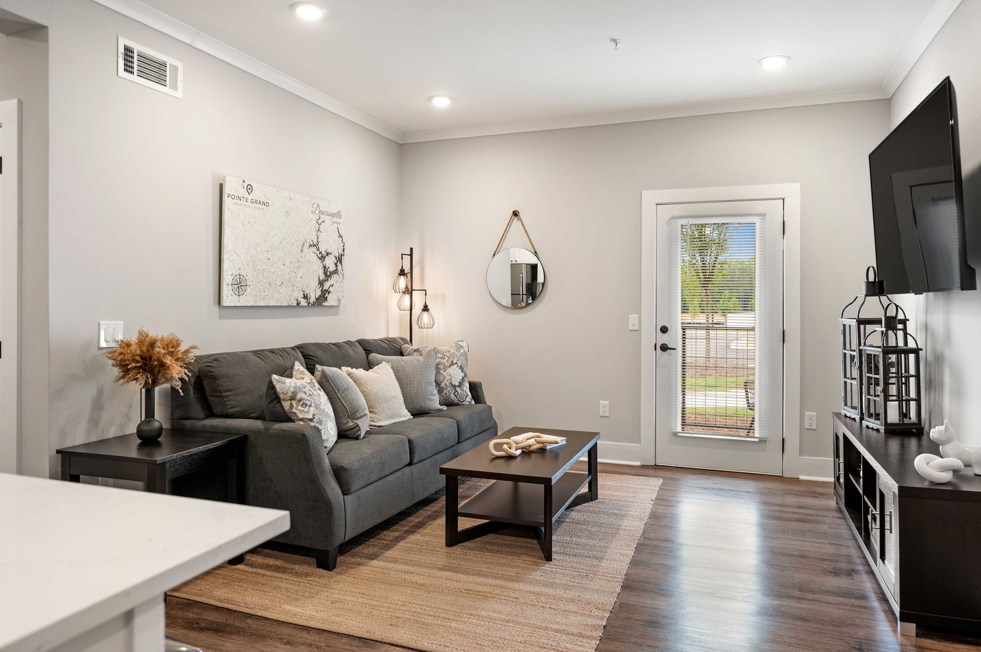 apartment living room at Pointe Grand Brunswick in Brunswick, GA.