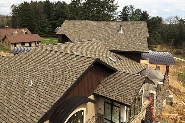 An Aerial View Of A Large House — Akron, OH — D&M Roofing LLC