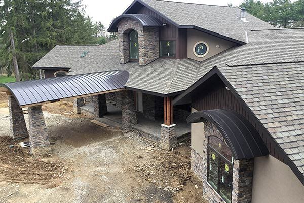 A House With A Gray Roof — Akron, OH — D&M Roofing LLC