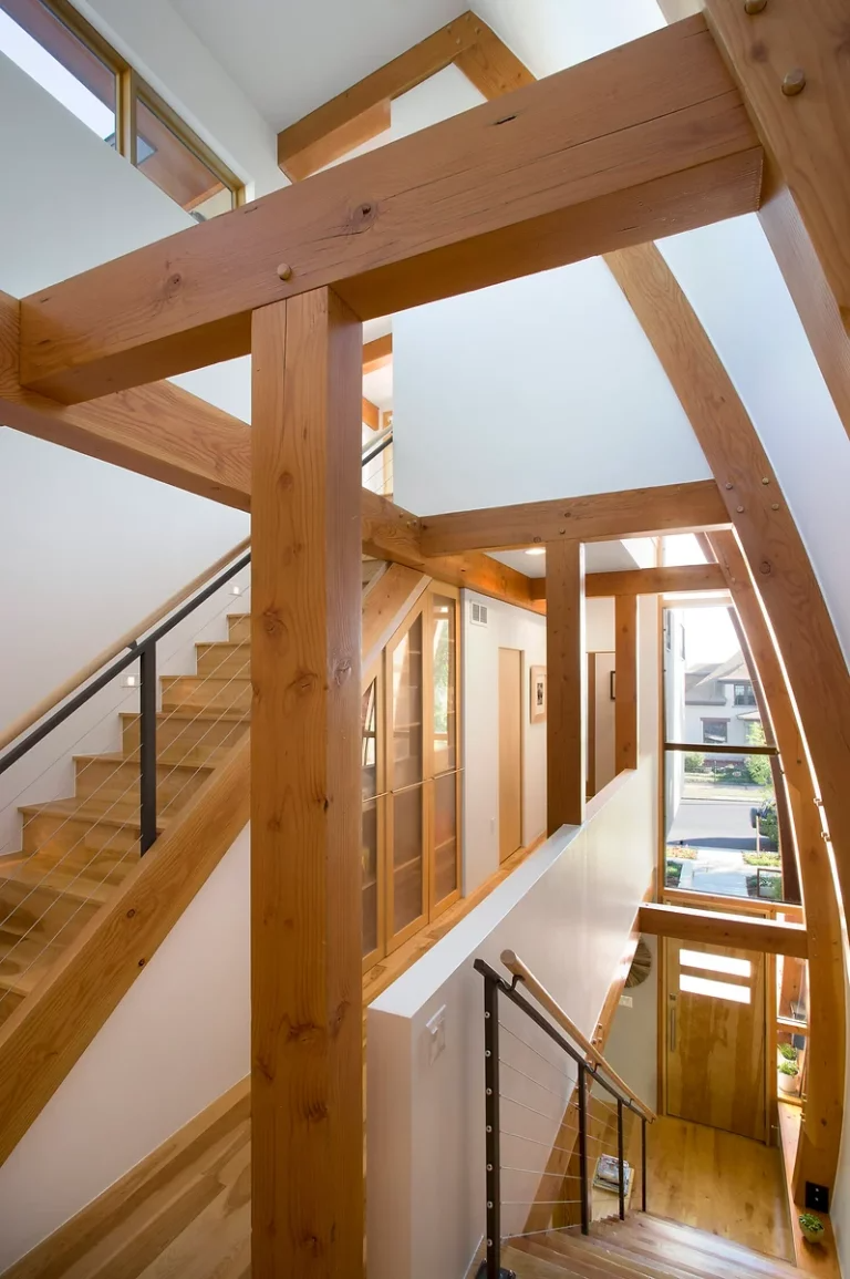 The Oak Staircase to a Custom Home By Movement Custom Homes in Mid-Missouri