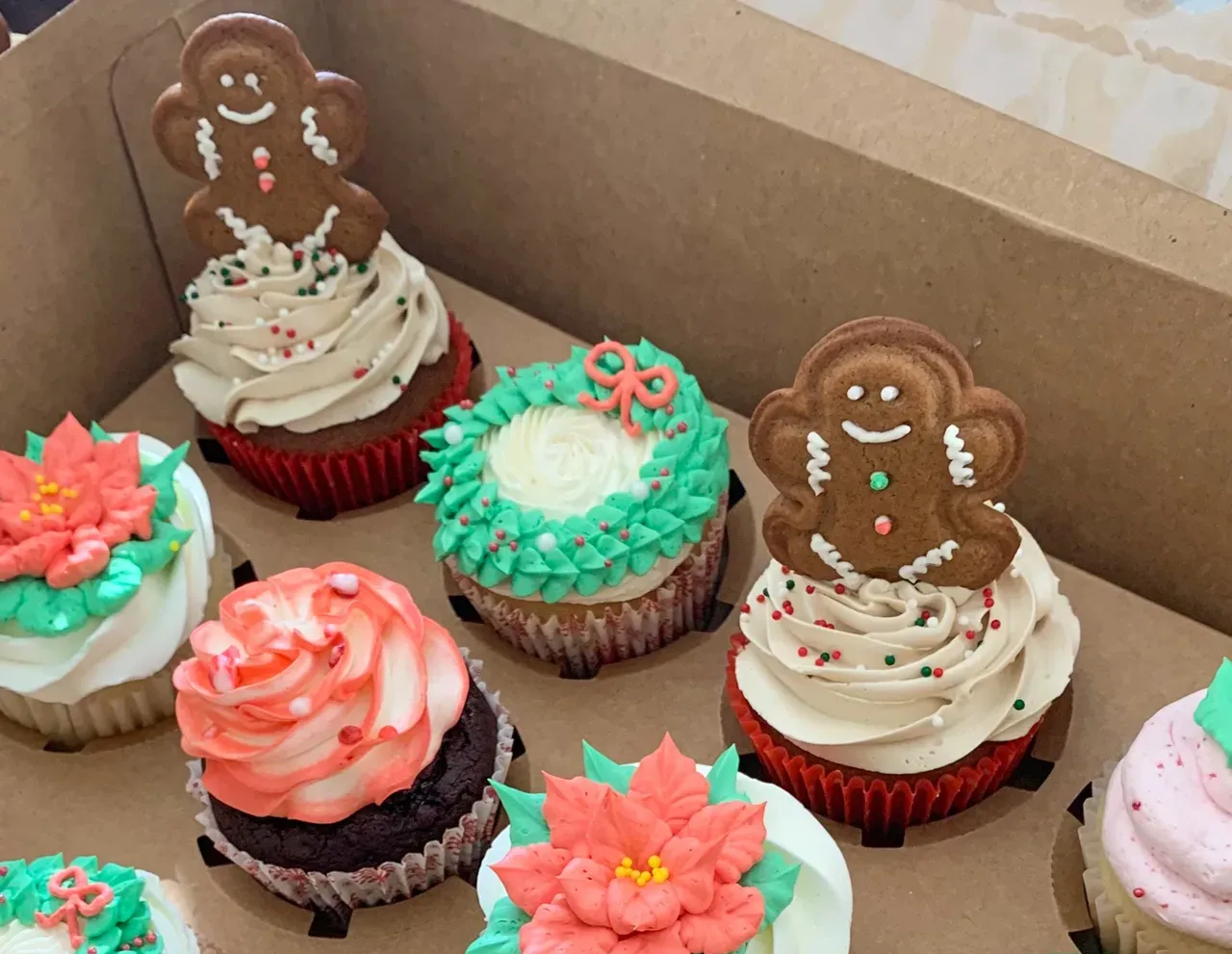 Bouquet of cupcakes decorated to look like flowers; shades of pink and white frosting.