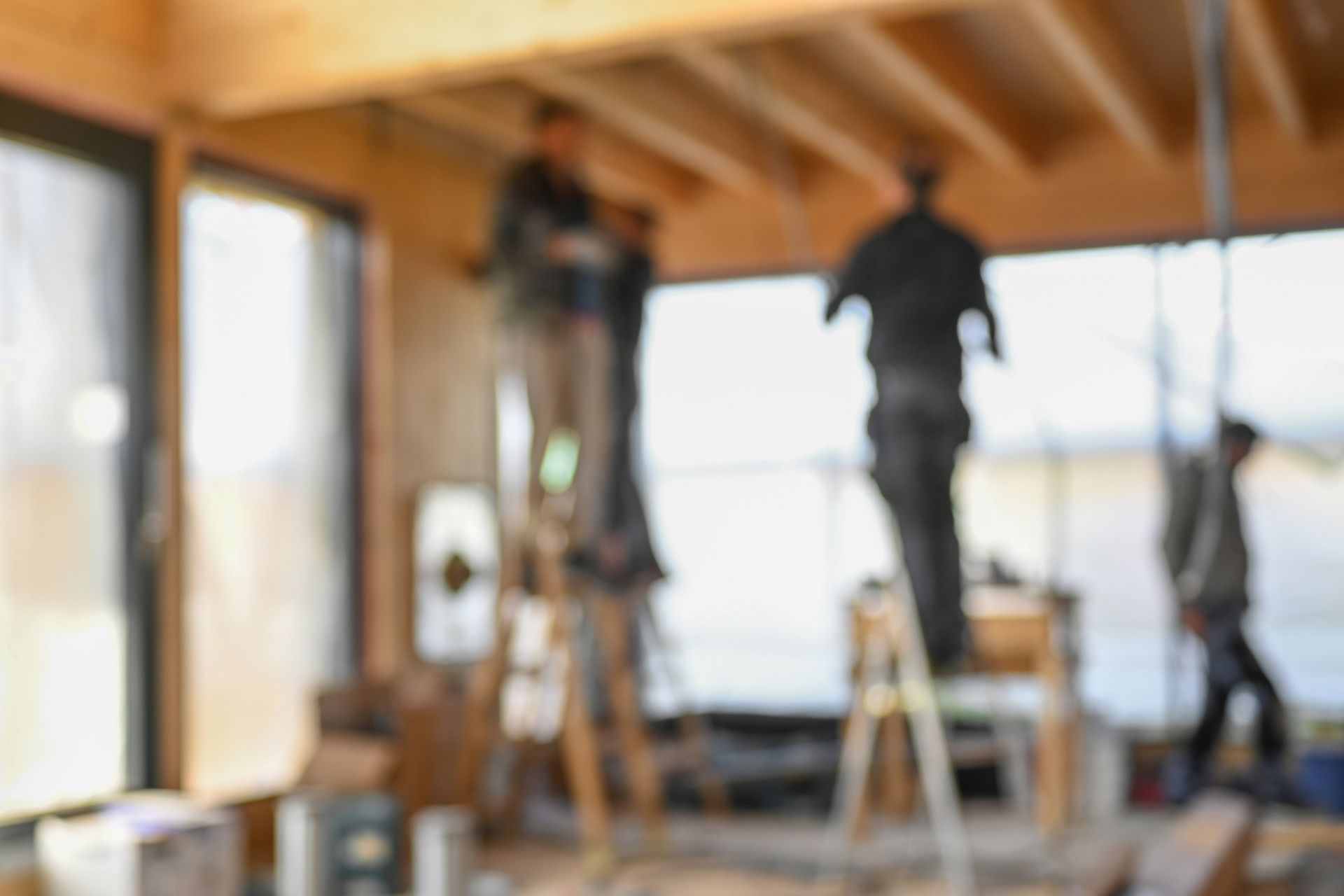 A blurry picture of a group of people working on a building.