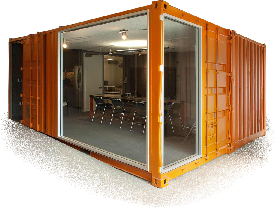 a container modified into an office space with orange exterior paint