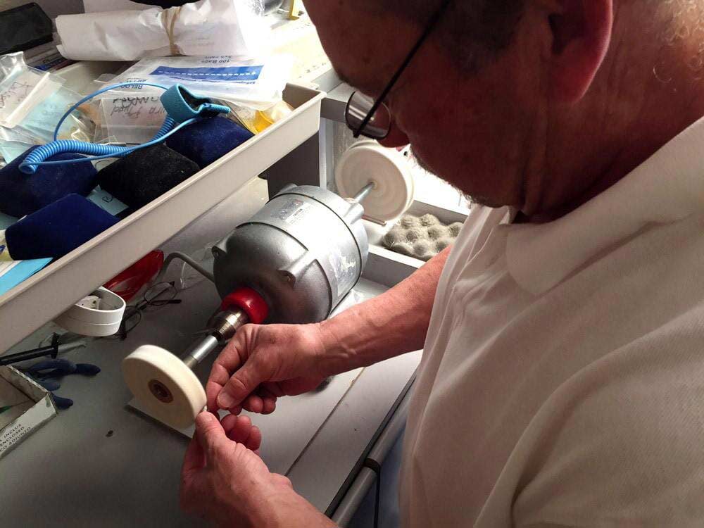 Hearing Aid Adjustment — Using Polishing Wheel on Hearing Aid — Bend, OR