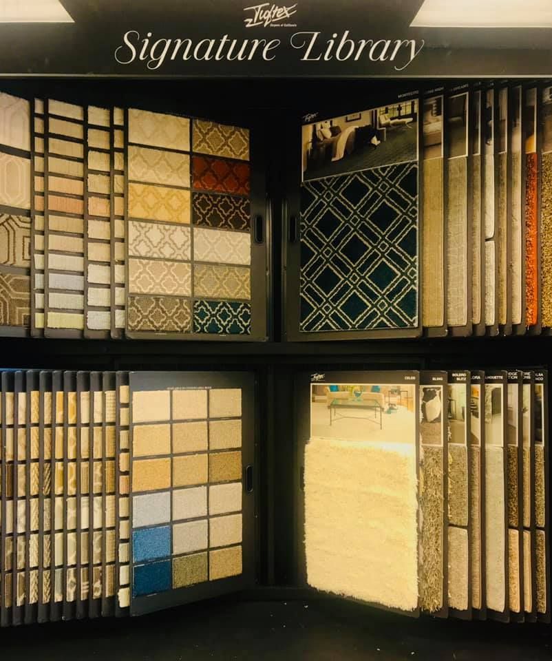 A display of signature library tiles and carpets