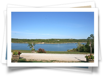 A picture of a lake with a blue sky in the background