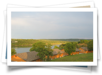 A picture of a lake with houses in the foreground