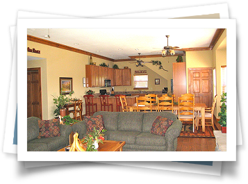 A living room with a couch a table and chairs