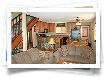 A picture of a living room with a couch and a lamp