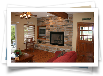 A living room with a fireplace and a sign that says broadway