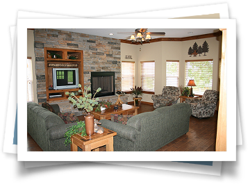 A living room with a fireplace and a television