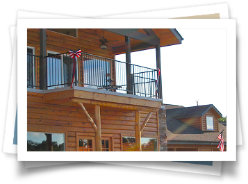 A picture of a wooden house with a balcony