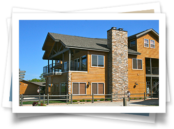 A large wooden house with a stone chimney