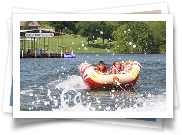 A group of people are riding a raft on a lake