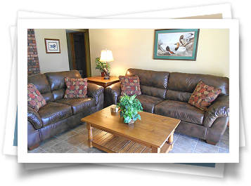 A living room with two couches and a coffee table.