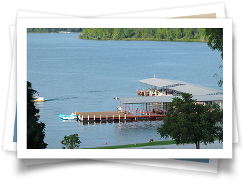 A boat is docked at a dock on a lake