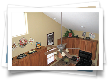 A picture of a kitchen with a ceiling fan