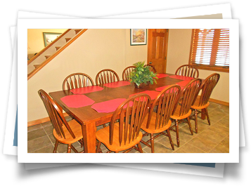 A picture of a dining room table and chairs